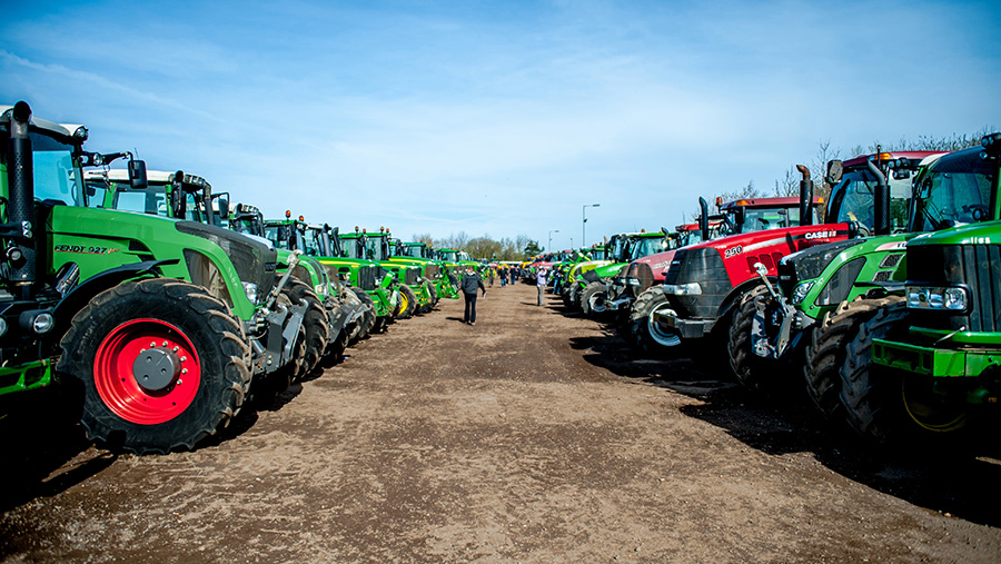 Line-up of tractors at an auction