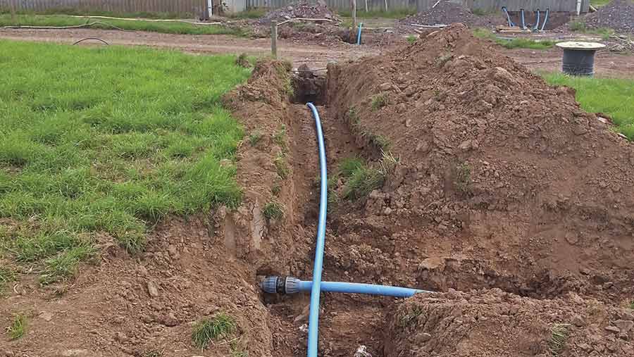 Laying water system with pipe