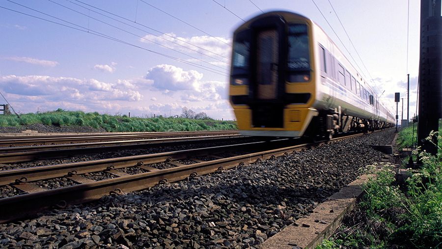 Train speeding along tracks