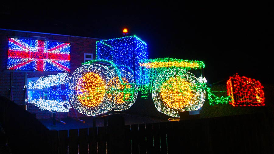 A tractor and plough made out of Christmas lights by Andrew Wilkinson