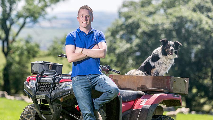 Jacob Anthony sits on an ATV alongside a sheepdog