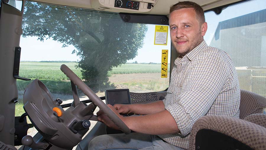 Neill Craig sitting in a tractor cab