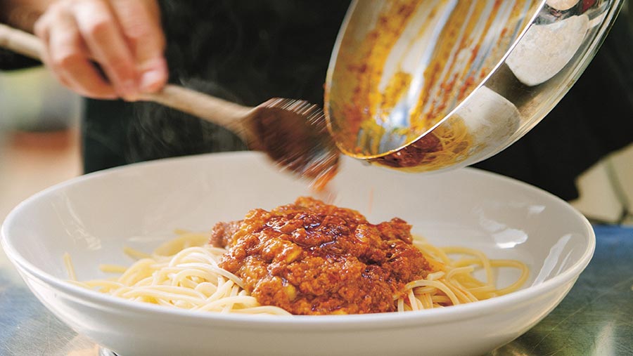 Spaghetti bolognaise being served up