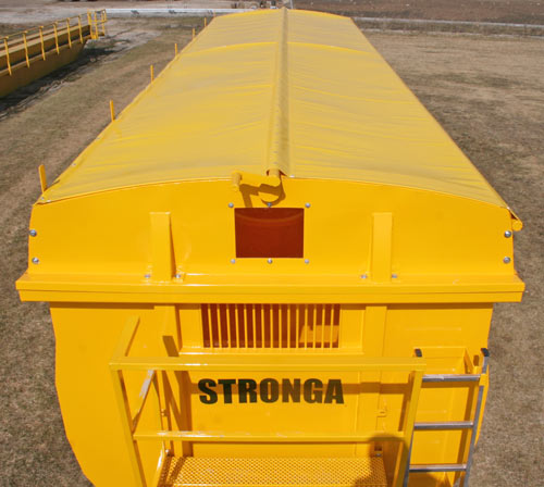 The Roll Sheet available on Stronga trailers is opened and closed front a bulkhead platform using a winding handle on the centre pole.