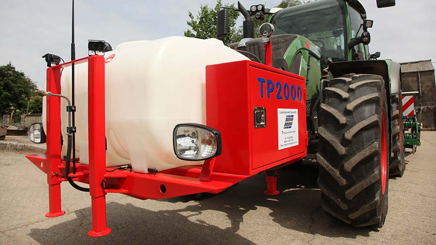 Polyethylene fertiliser tank mounted to front of tractor