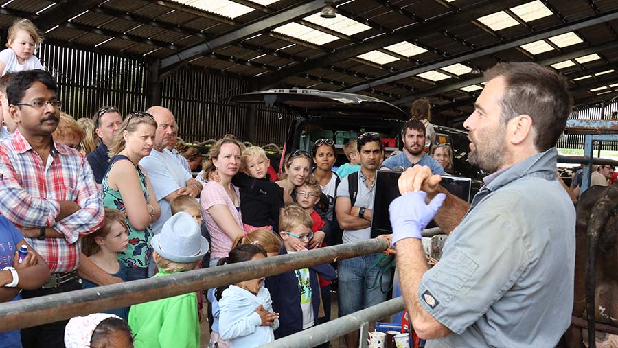 Open Farm Sunday visitors listen to farmer talking © LEAF Open Farm Sunday