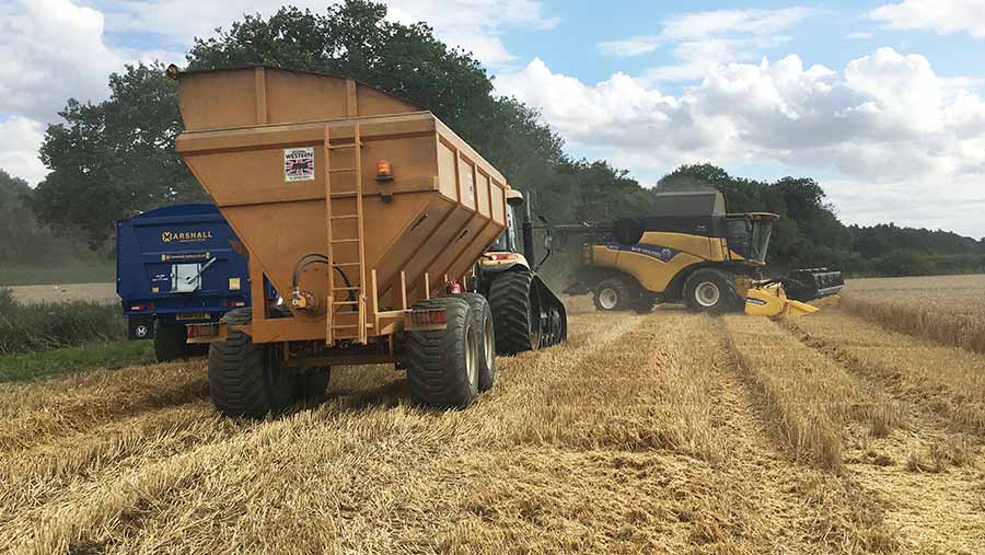 A chaser bin works in a field
