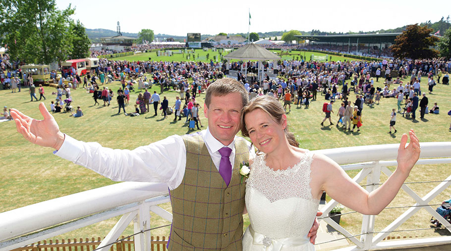 Chris Moorhouse and Liz Bailey in their wedding attire pose for photos at the Great Yorkshire Show