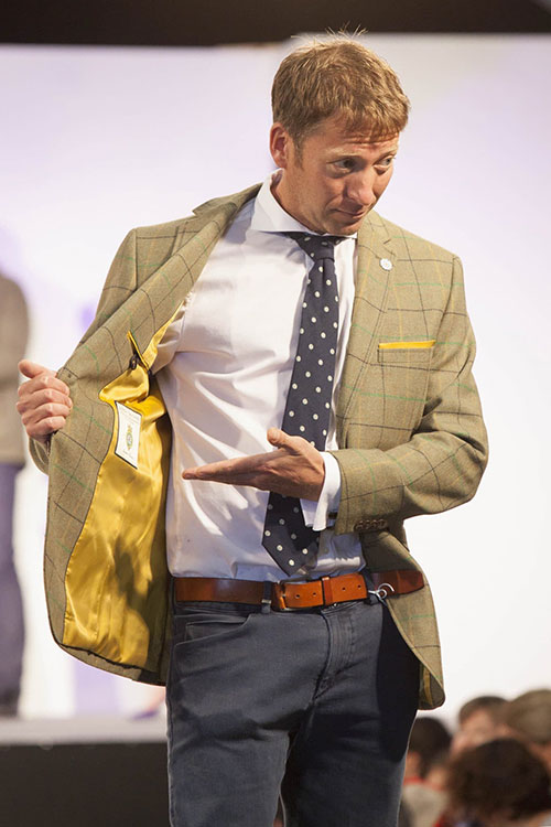 Julian Norton demonstrates the lining of his tweed suit