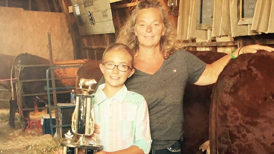 Kim Jo Bliss and niece pose for a photo with a trophy