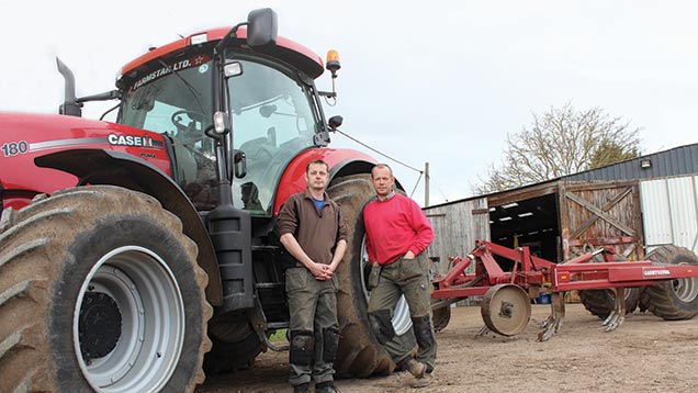 Rob (left) and Dave Gash with their Case Puma 180 and stubble cultivator.