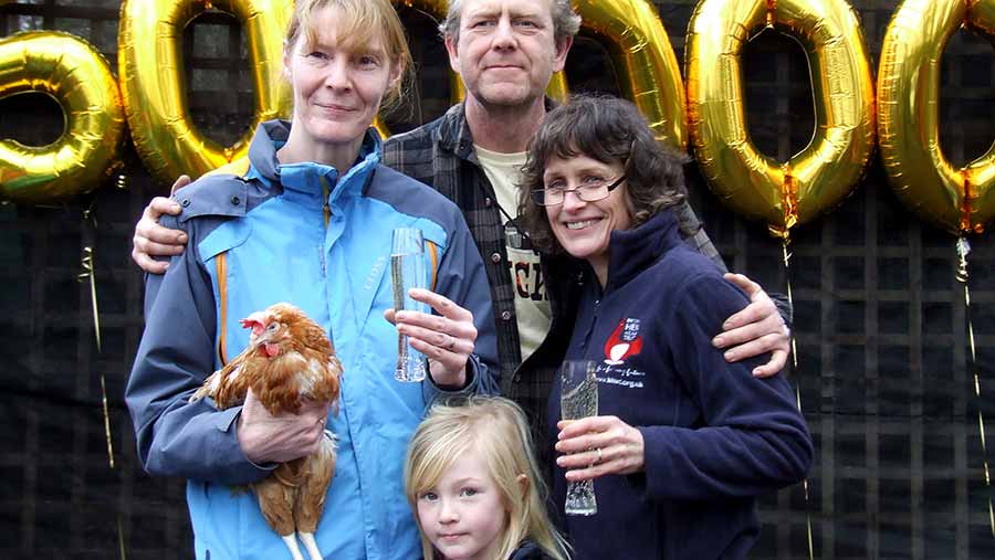 Jane Howorth with the Elliot family, who received the 500,000th hen rehomed by the trust