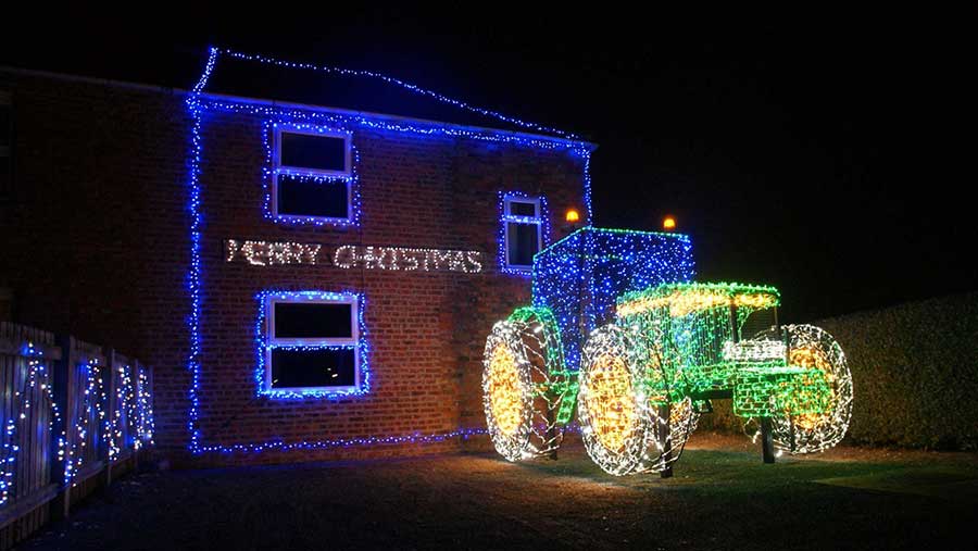 Fullscale tractor in Christmas lights is a hit on social media