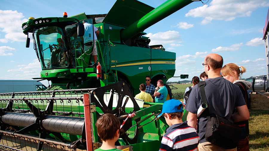 Open Farm Sunday visitors look at combine