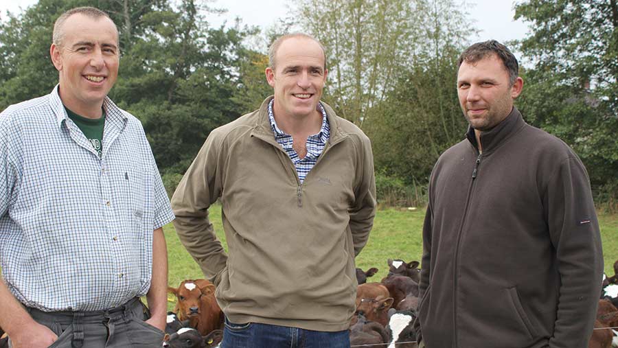 Left to right: Brothers Chris and Rich Norman with Krisztian Takacs, dairy manager 