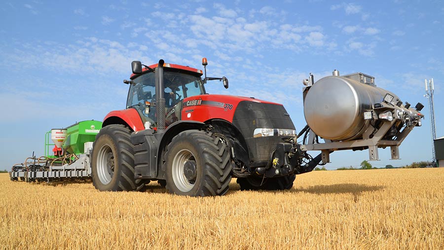 Case tractor with front-mounted stainless steel tank