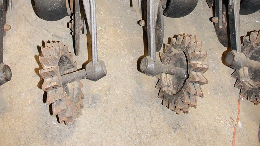 Close-up of spiked steel wheels on JD 750a