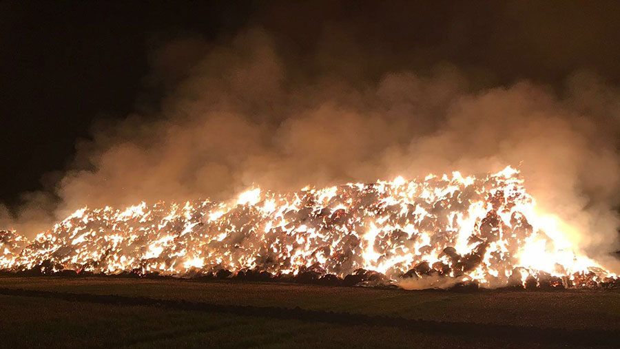 Straw stack burns during the night