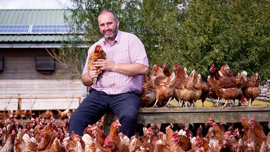 Phillip Crawley holding a chicken