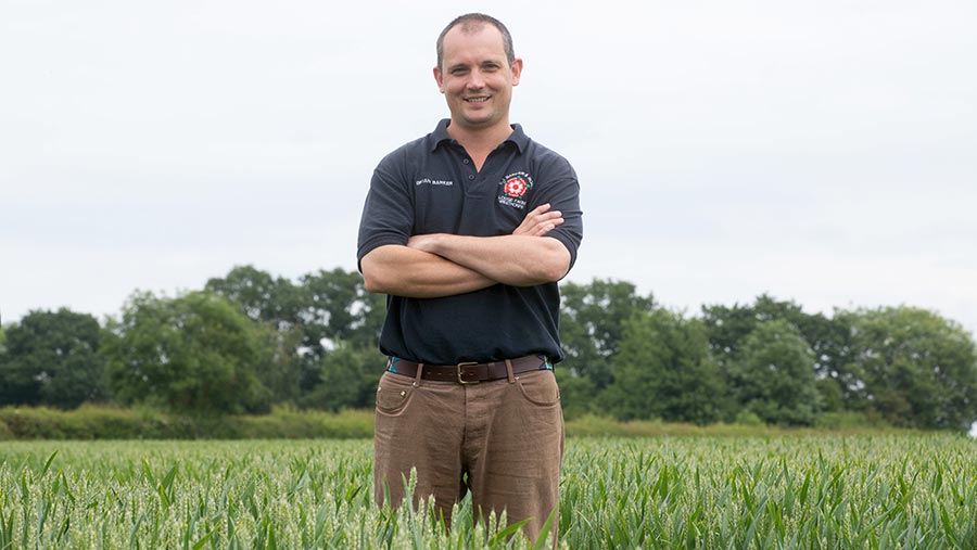 Brian Barker standing in a field