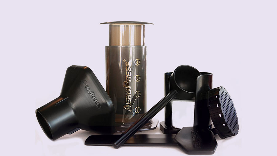 The AeroPress single-cup coffee maker with various accessories