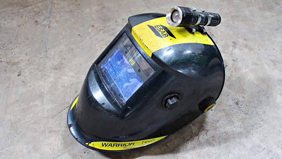 An ordinary LED torch clips on to the top of a welding mask