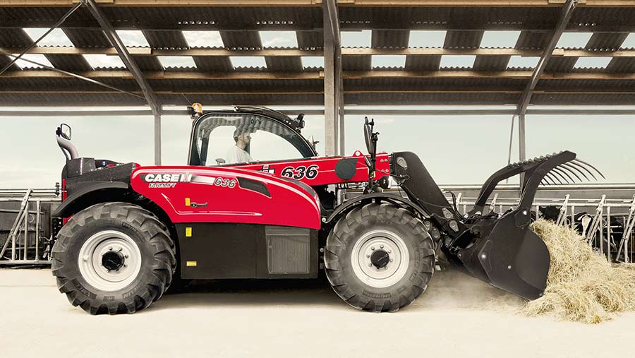 A case telehandler moving straw for a livestock shed