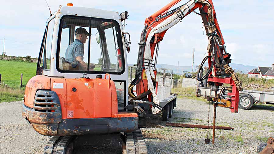 Post knocker attached to the Kubota mini digger