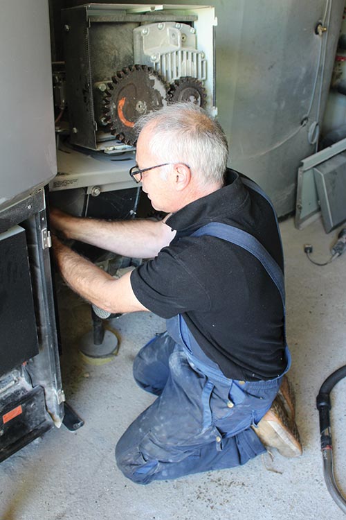 Mark Campbell  working on a biomass boiler