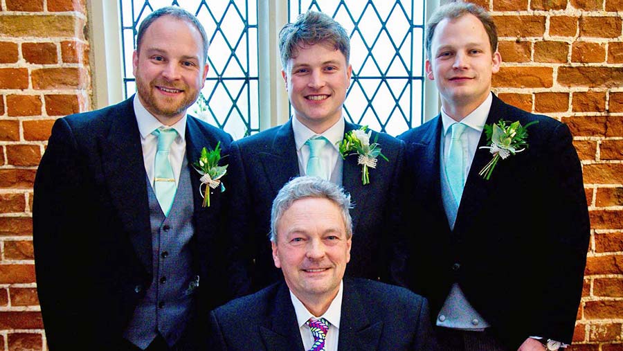 Dad with his three boys at my brother George’s (centre) wedding. My oldest brother Tim is on the left.