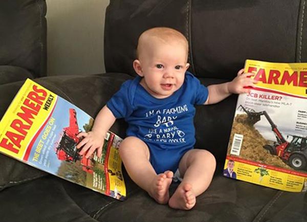 Baby on safe with two Farmers Weekly magazines