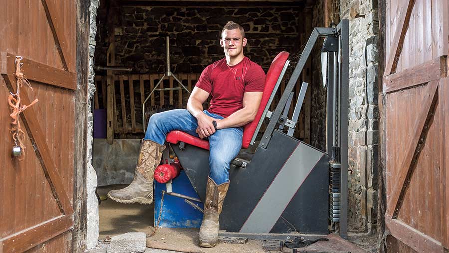 Rugby player Dan Lydiate sits in his barn