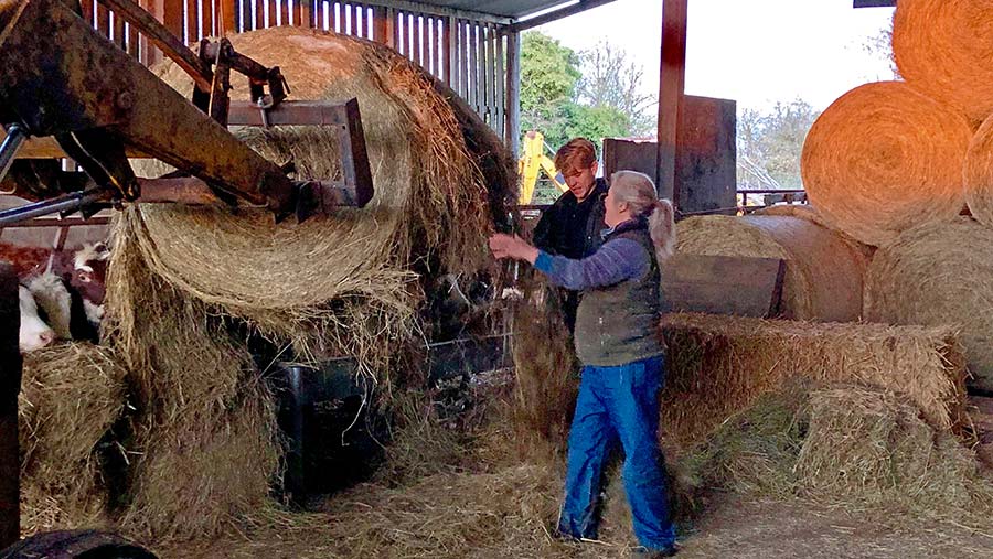 Rufus helps mum Sarah Denne on the farm © Oli Hill/RBI