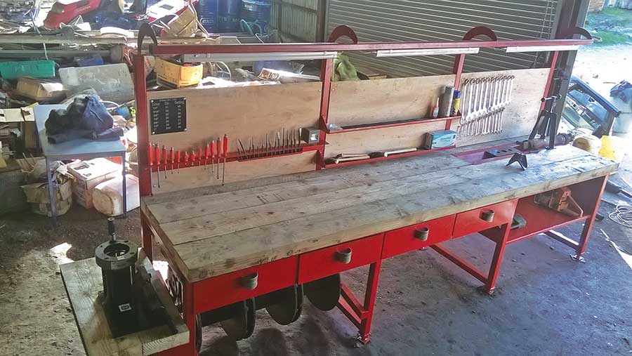 Workbench with hand tools and a thick wooden work surface