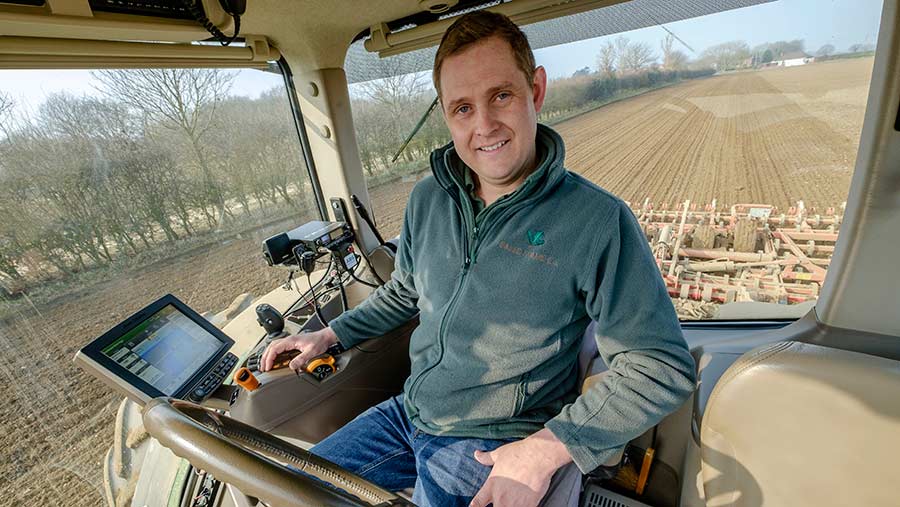 Farmer Will Jones in the cab of his tractor