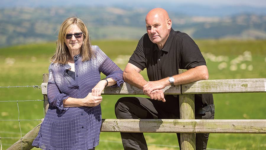 John and Sarah Yeomans by a fence