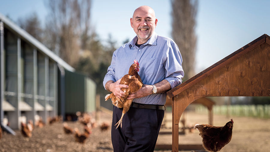 Leon Furlong with one of his hens on the farm