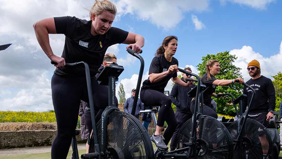 From left: Sarah Phillips, Jemma Harding and Claire Moreton dig deep on the assault bikes © Colin Miller/RBI