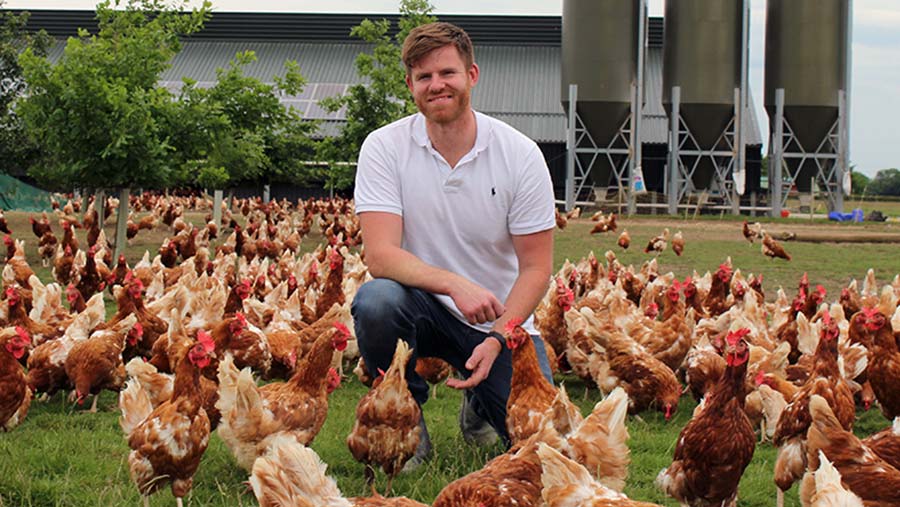 Matt Havers with hens © Oli Hill/RBI