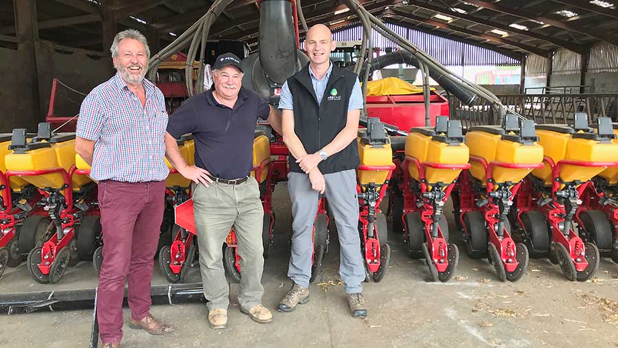 Martin Smart, centre, and Paul Gruber, right, with agronomist Gavin Moss in front of the Vaderstad