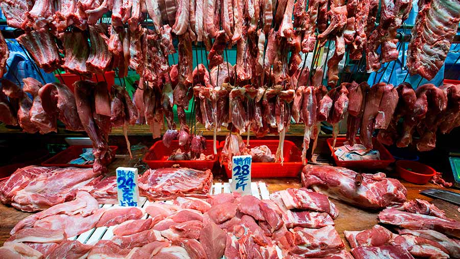 Pork on sale at a market in Hong Kong © Alex Hofford/EPA-EFE/Shutterstock