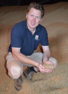 Farmer Alan Clifton Holt in his grain store