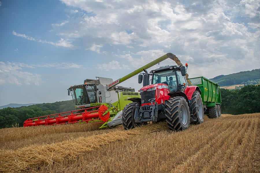 Combine and tractor by Zak Mumford