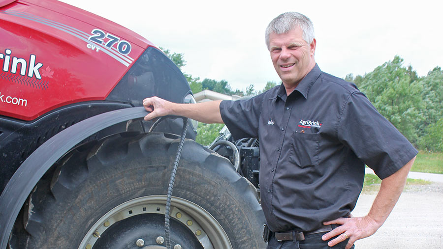 Jake Kraayenbrink standing with tractor