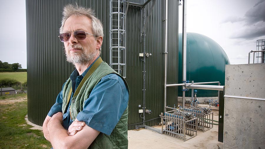 Stephen Temple in front of a digester