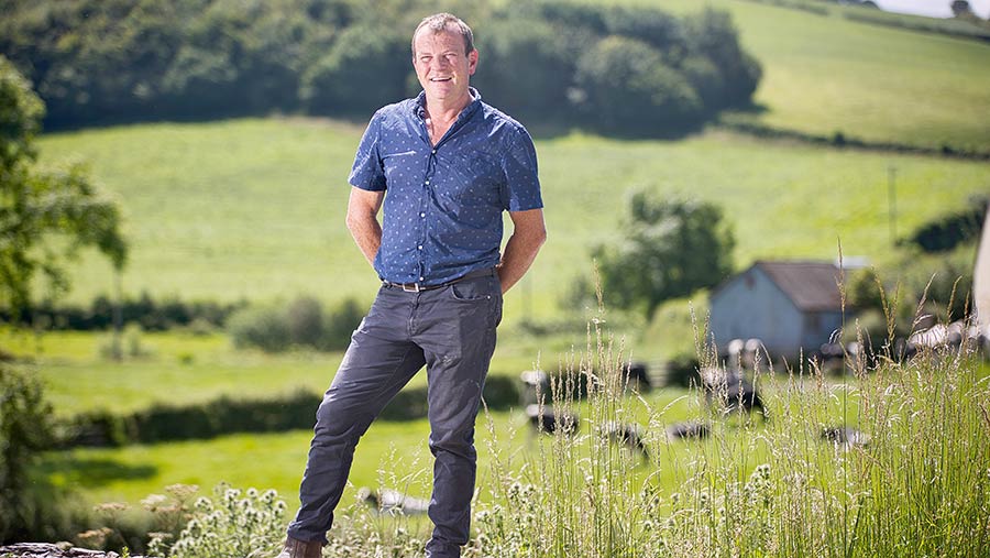 Martin Evans standing in a field