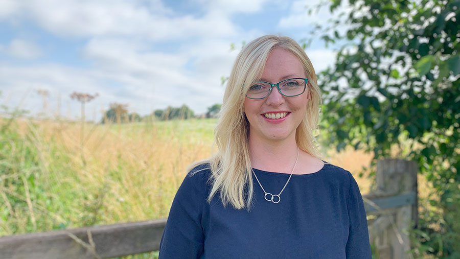 Sally Moore with a landscape background