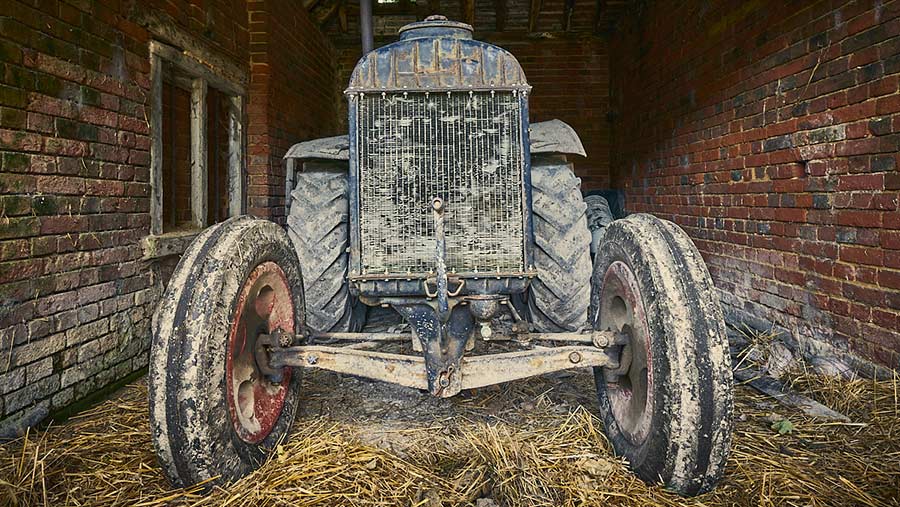 Old tractor in barn by Matthew Thomas