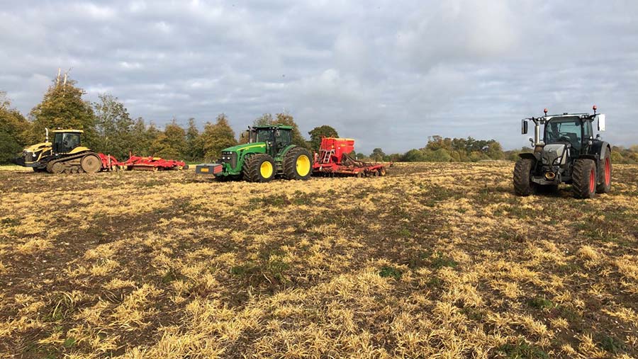 Tractors in field working on headland management