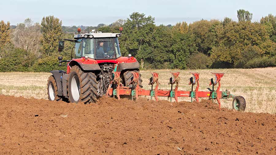 Massey Ferguson 7718 working in field